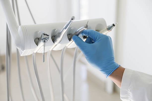 Professional Tooth Extraction technician working in Forsgate, NJ